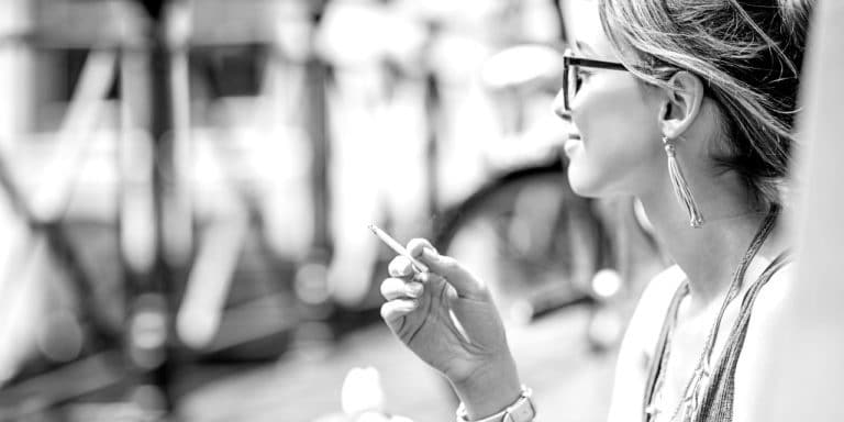woman in glasses with joint - 2X1