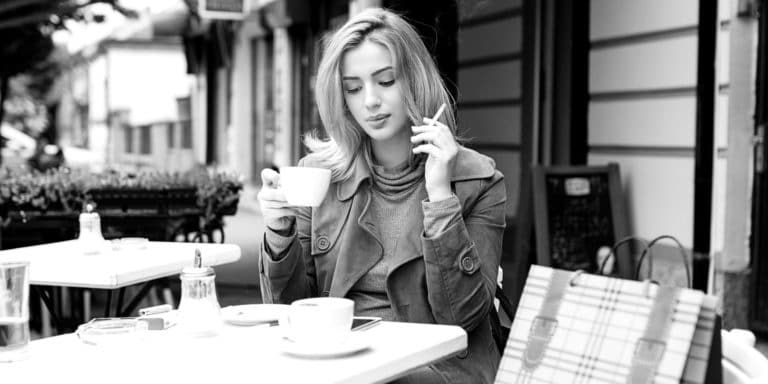 woman at table smoking BW 2X1